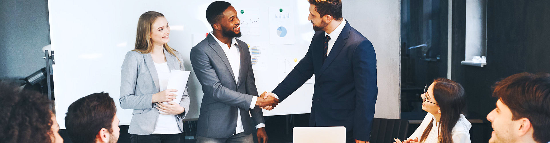 two people shake hands